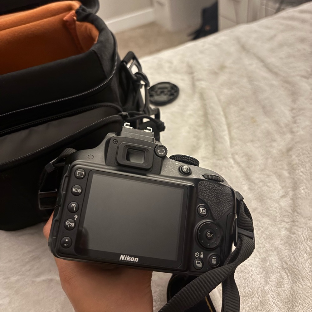 Nikon Black DSLR Camera with Orange Interior Case - Picture 2 of 7